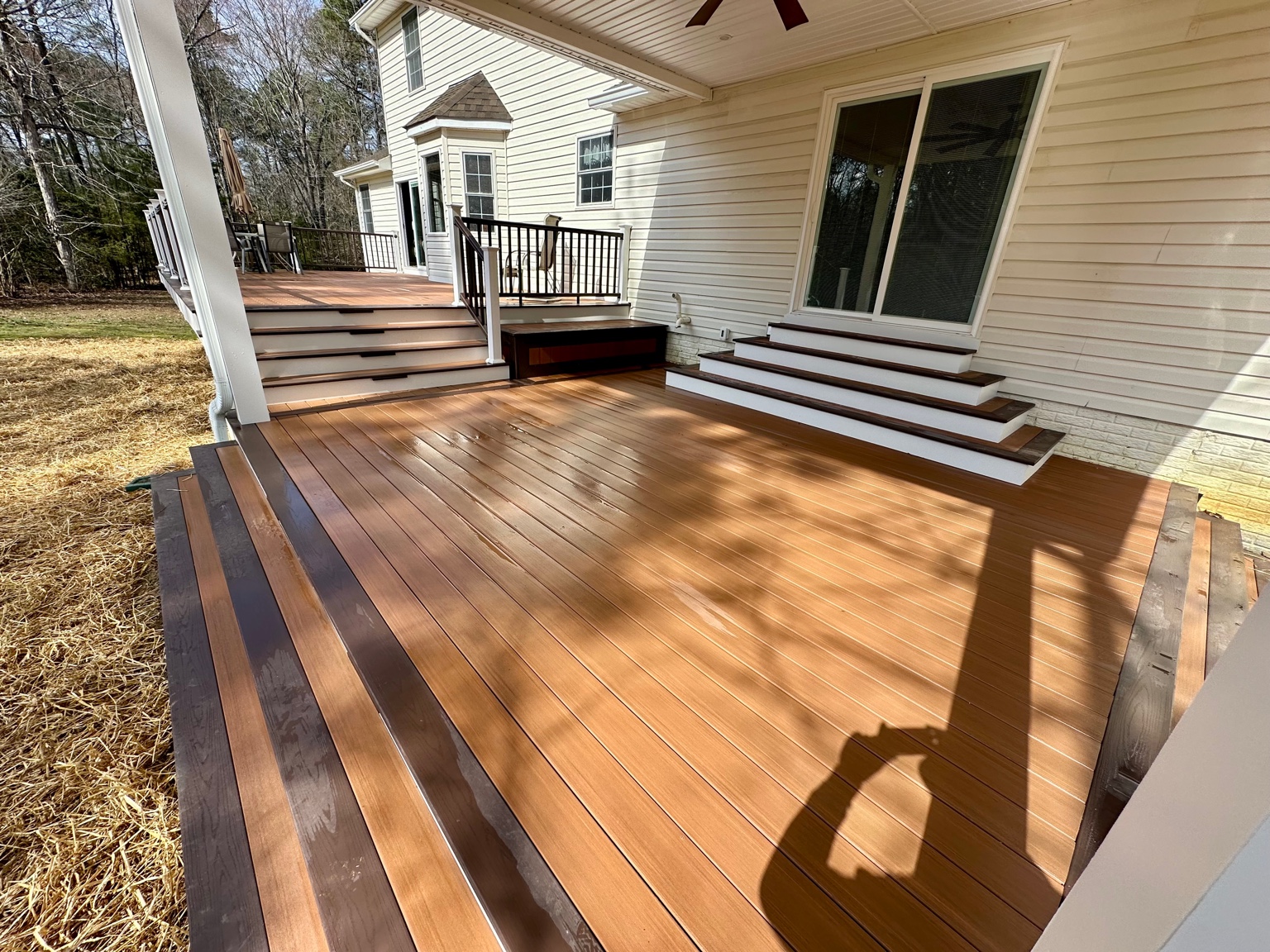 Two-tone composite deck with wrap steps