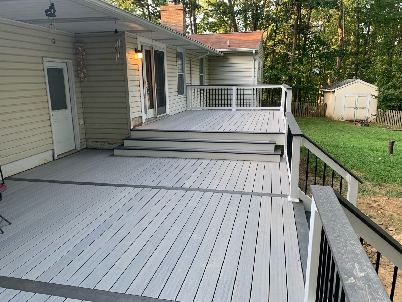Modern gray composite deck with black rails