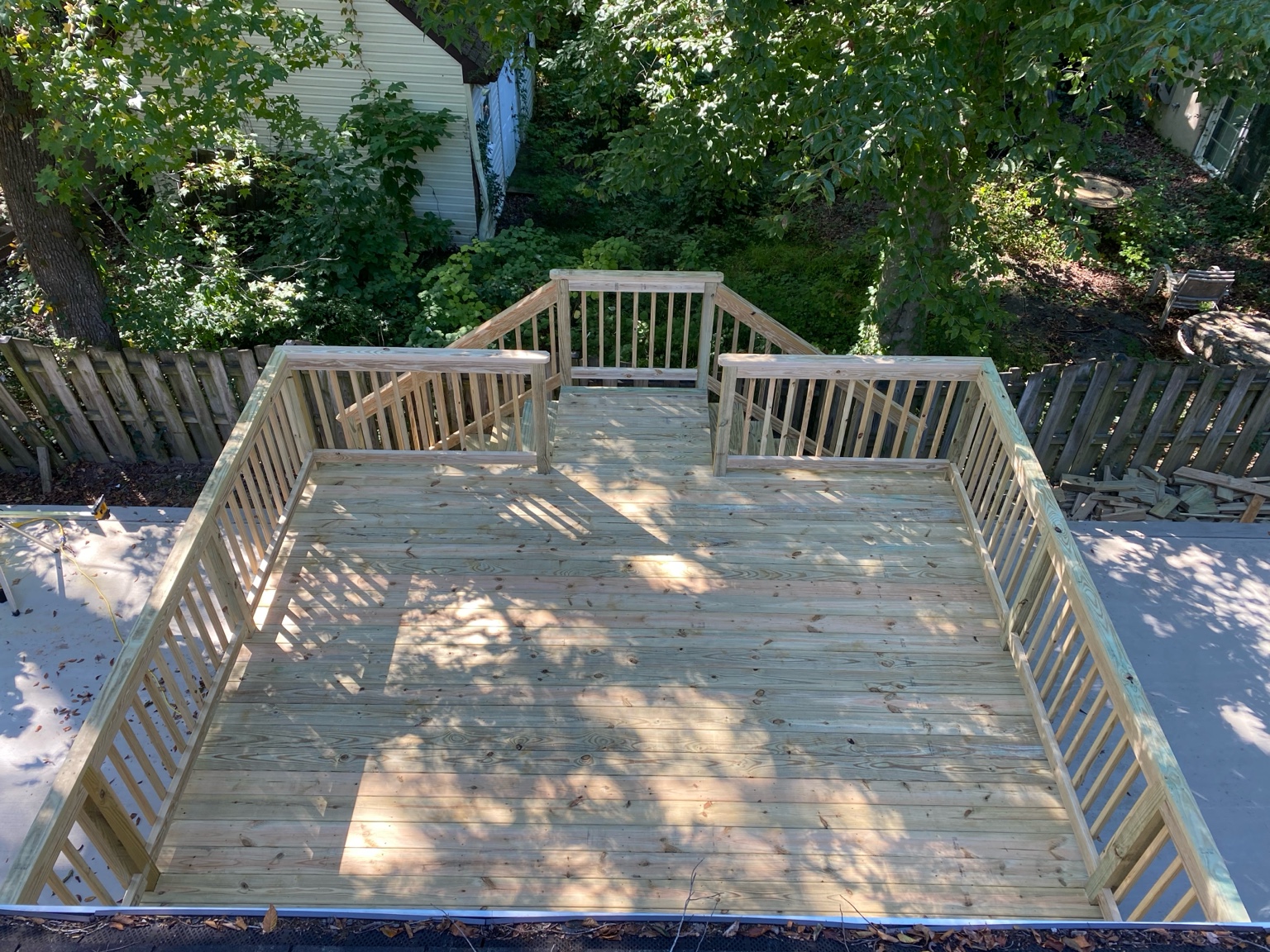 Fresh pressure-treated deck framing before decking