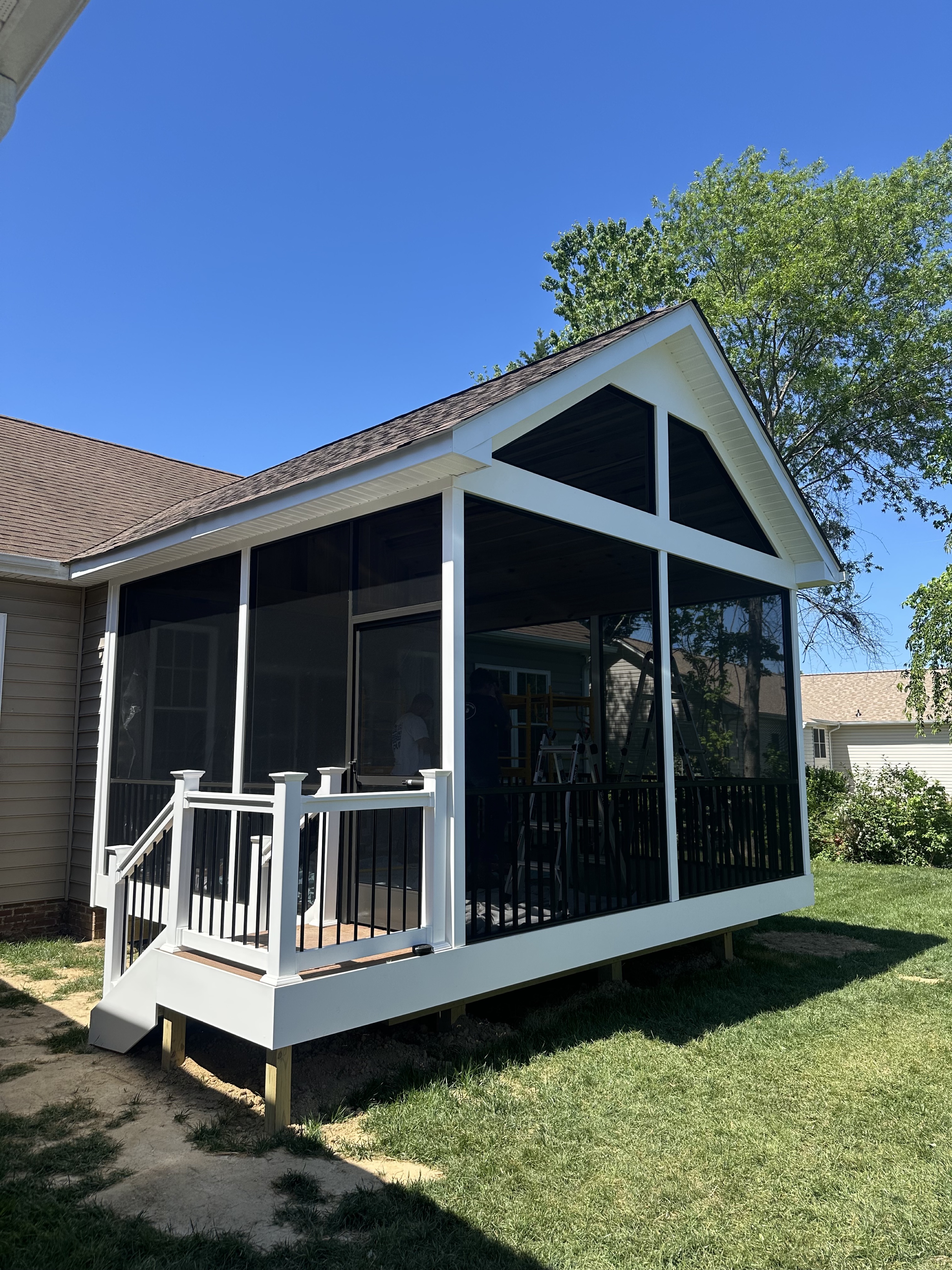 After — angled view of screened porch tie-in